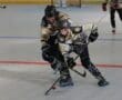 Inline hockey players compete for the puck during a fast-paced match on the rink. Racing, competition, sports action.