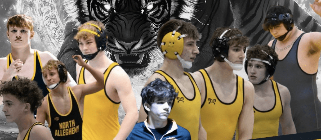 High school wrestlers in yellow singlets with tiger backdrop, focused and ready for competition.