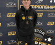 Young athlete with medal at TSTCA Indoor Track & Field Championships. North Allegheny uniform.