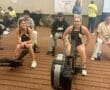 Indoor rowing competition at Pittsburgh championships, participants on erg machines ready to race, lane 3.