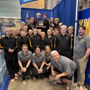 Boys swimming team poses with their trophy, celebrating their victory at the 2023 WPAL championships. Team pride shines through!