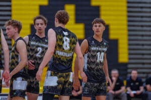 North Allegheny volleyball players in action, showcasing teamwork and athleticism in a competitive match setting.