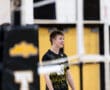Smiling volleyball player in a North Allegheny jersey, enjoying a moment on the court during a game.