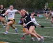 High school girls flag football players in action, showcasing competitive spirit on the field.