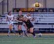 Girls' high school soccer match in action, featuring players from Fox Chapel and other teams battling for the ball.