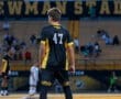 Soccer player #47 stands on the field at Newman Stadium, North Allegheny, with spectators in the background.
