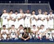 North Allegheny boys' soccer team poses for a group photo on the field, showcasing camaraderie and team spirit.