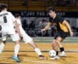 High school soccer match action, with players from the Tigers and Dragons competing for the ball on the field.
